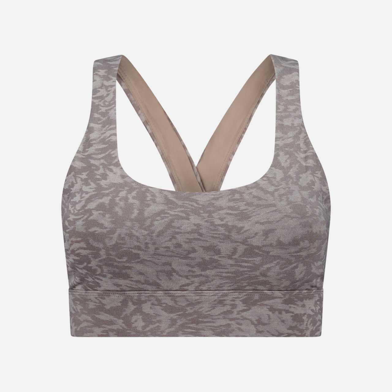 The GREYSON Midas Wolf Jacquard Sports Bra in grey features a subtle abstract pattern, wide cross-back straps, and a thick underband. Made from breathable stretch fabric for medium support, it's displayed on a plain white background.
