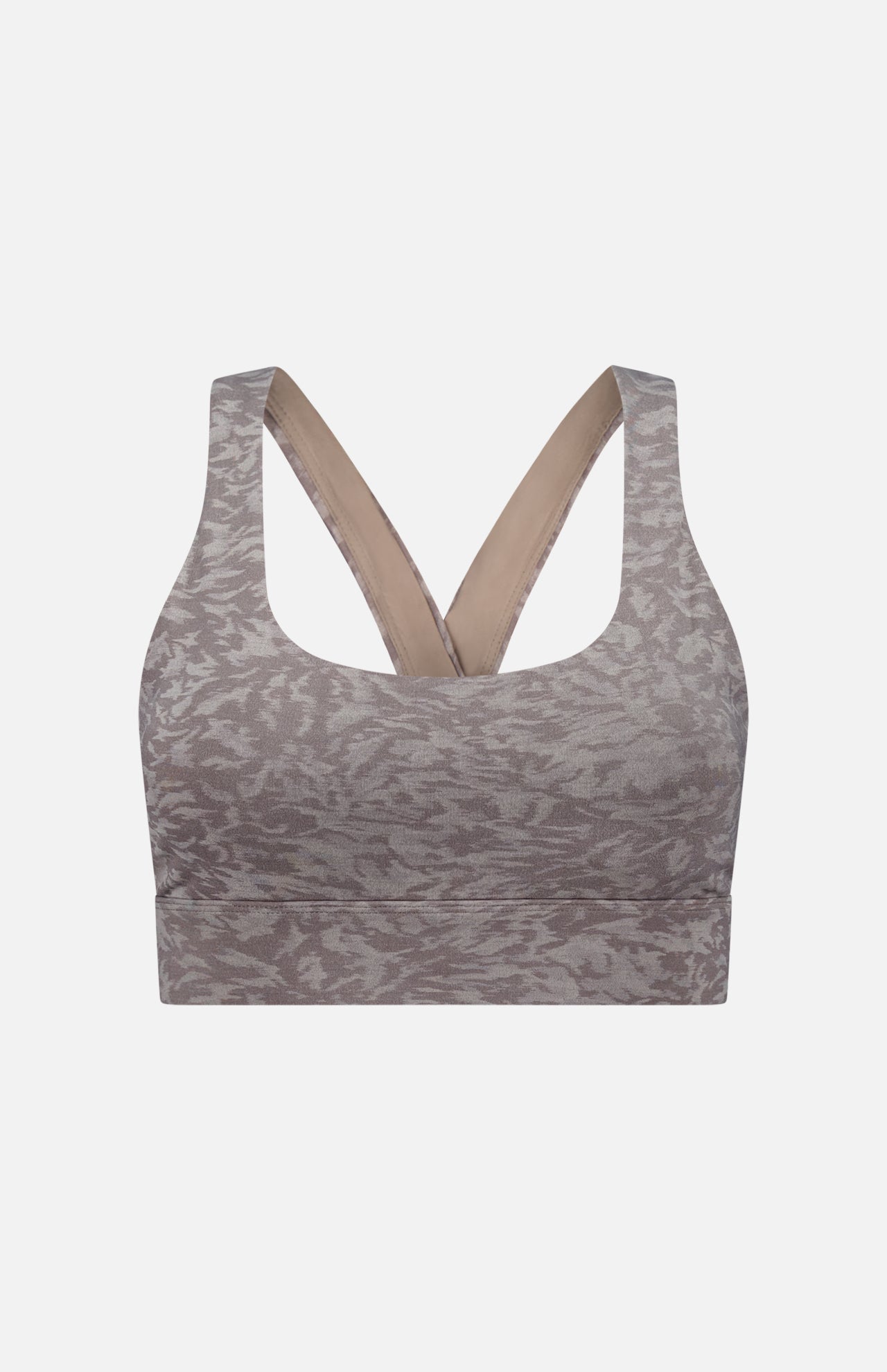 The GREYSON Midas Wolf Jacquard Sports Bra in grey features a subtle abstract pattern, wide cross-back straps, and a thick underband. Made from breathable stretch fabric for medium support, it's displayed on a plain white background.