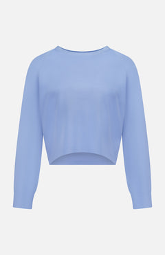 The GREYSON Ojai Cropped Crewneck Sweatshirt in light blue features a cotton blend, crew neck, ribbed cuffs, and a relaxed fit, shown against a plain white background.