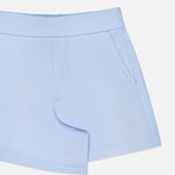 The GREYSON Ojai Trouser Short for women features a light blue, soft cotton-blend fabric, an elastic waistband, and side pockets. Shown on a plain white background with only the upper portion and left side of these comfy mid-rise shorts visible.