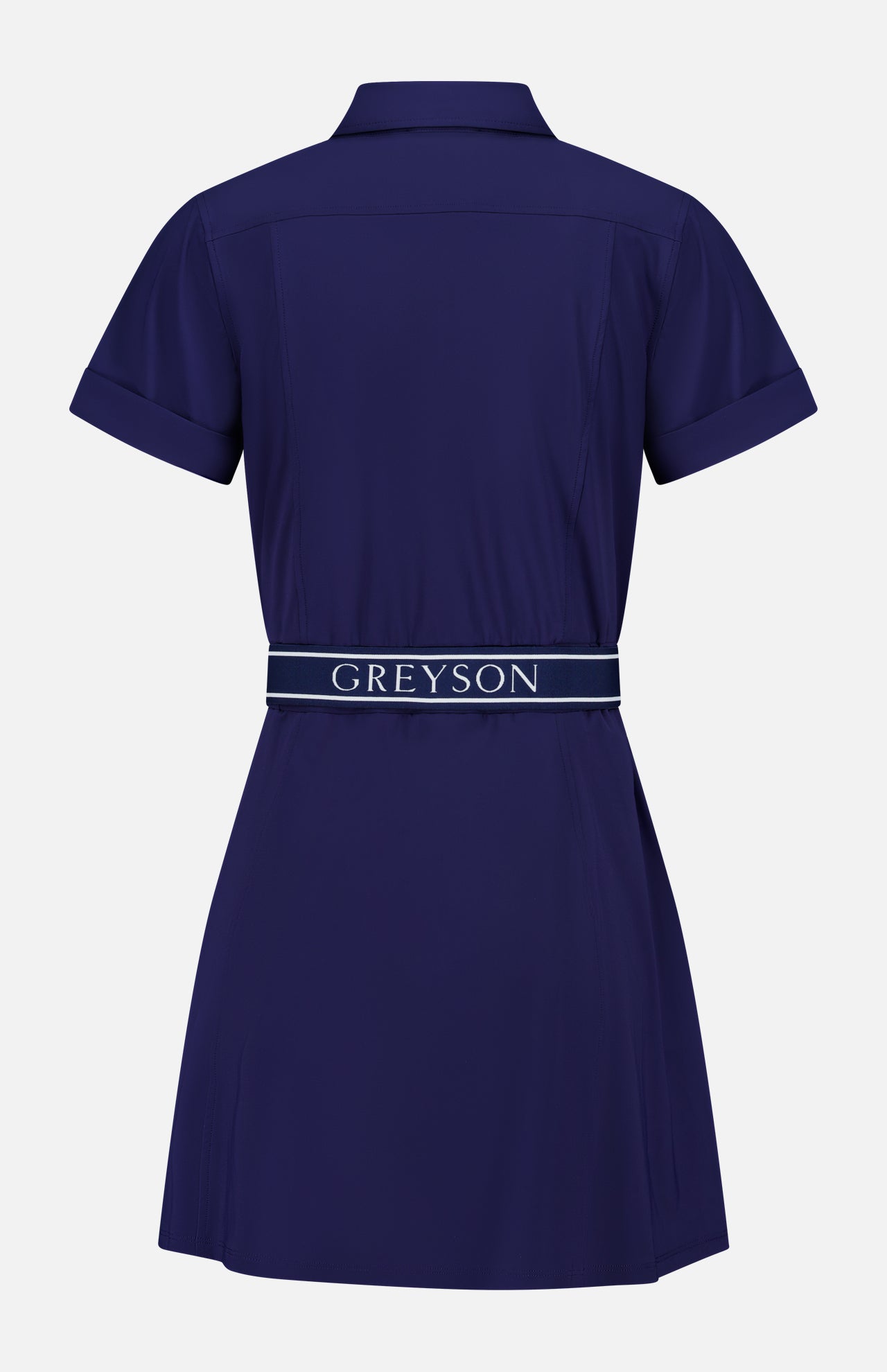 The Phoenix Belted Shirt Dress by GREYSON is a navy blue, short-sleeve mini dress shown from the back, featuring a collar and a matching navy belt emblazoned with the GREYSON logo in white. Made from Italian stretch fabric, this technical shirt dress offers a slightly flared skirt and cuffed sleeves for a refined yet comfortable style.