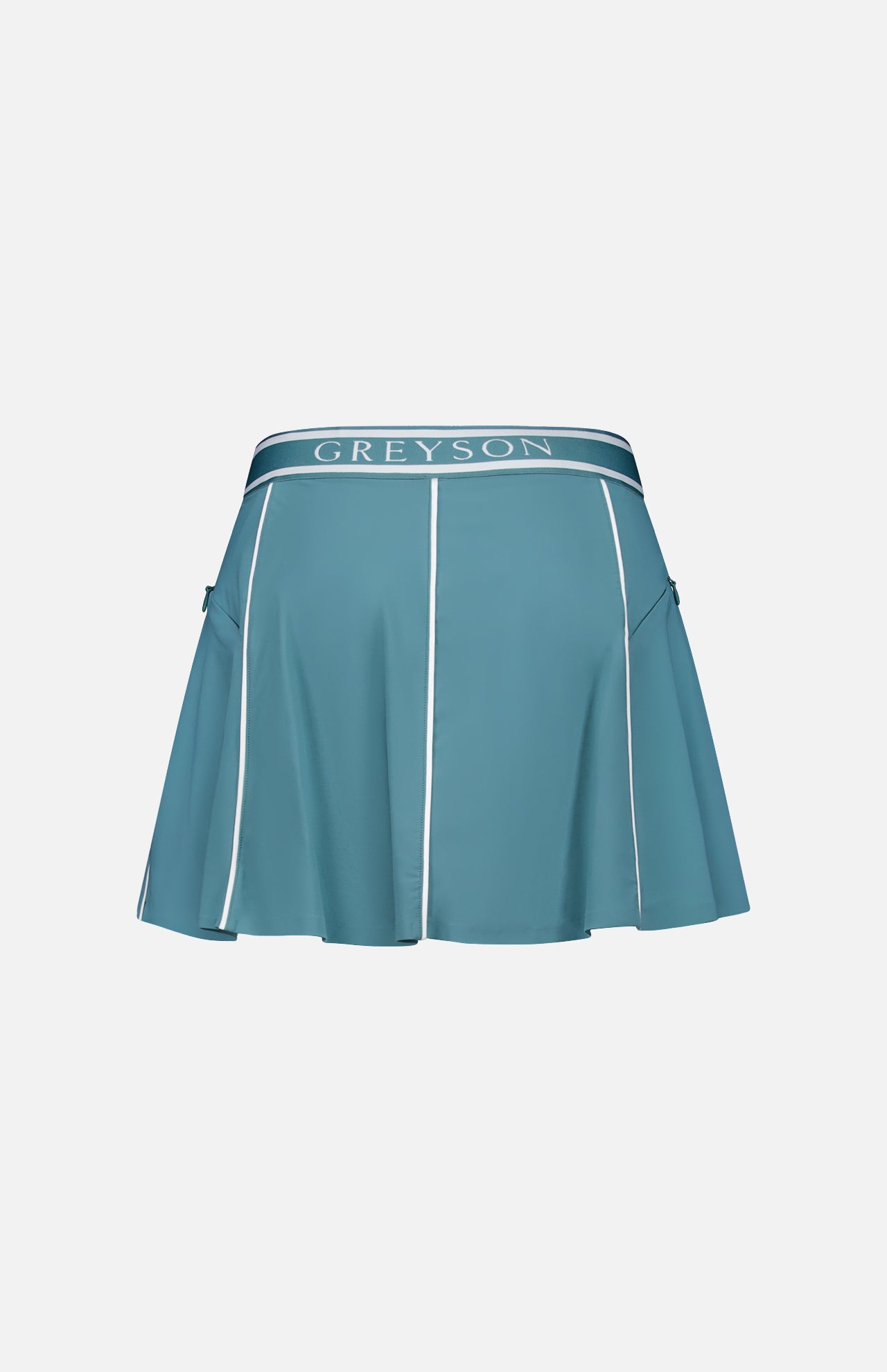 The Phoenix Flare Mini Skirt by GREYSON is a blue athletic mini skirt with white piping, flared hem, logo waistband, side zip pockets, and quick-drying boy short lining, shown on a plain white background.