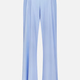 The Phoenix Wide Leg Trouser Pant by GREYSON is shown from the back in light blue, featuring an elastic waistband, high waist, wide legs, and two welt pockets crafted from a premium Italian blend.
