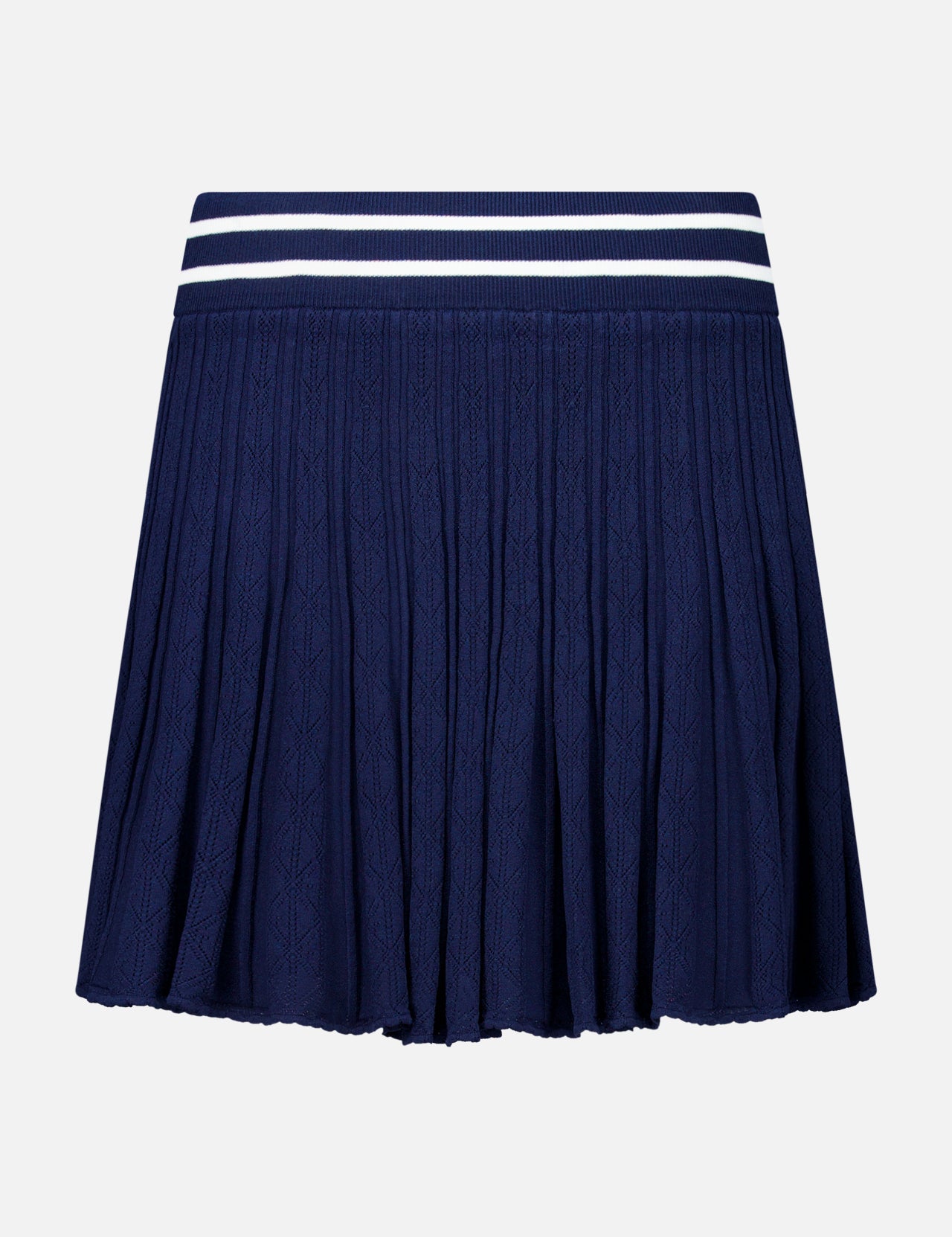 The GREYSON Pointelle Mini Skirt features a navy blue pleated design with a textured pointelle pattern and a wide, elastic waistband accented by two white horizontal stripes near the top. Crafted from quick-dry fabric for enhanced comfort, this dark blue skirt is showcased against a plain white background.