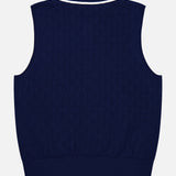 The Pointelle Sleeveless Polo Top by GREYSON is showcased from the back, featuring a navy blue technical knit with a subtle textured pattern and white trim accenting the collar, armholes, and hem—delivering a modern reinterpretation of the classic sleeveless top.