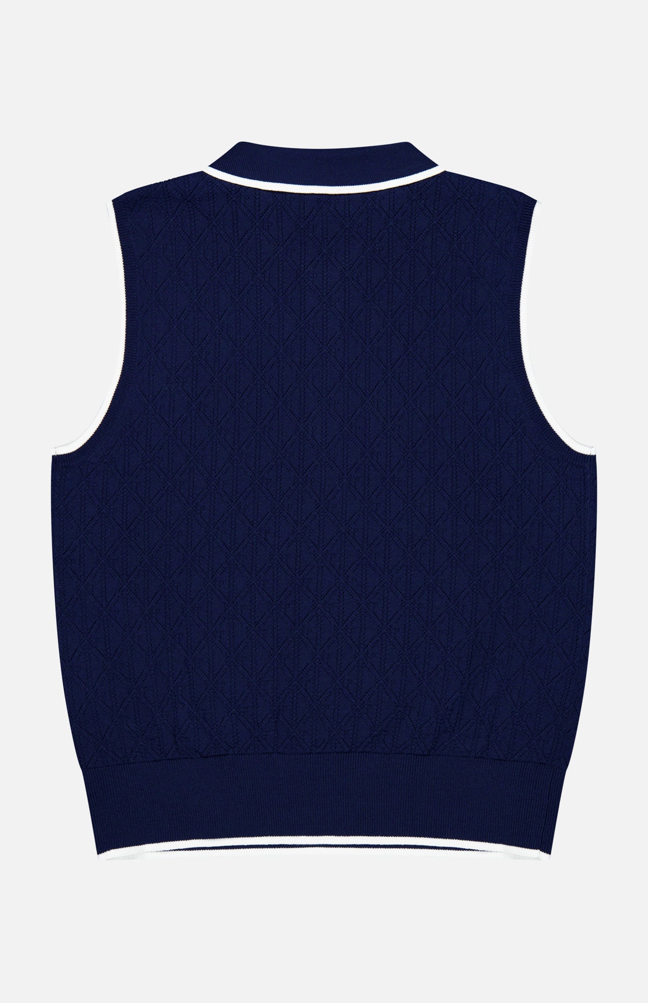 The Pointelle Sleeveless Polo Top by GREYSON is showcased from the back, featuring a navy blue technical knit with a subtle textured pattern and white trim accenting the collar, armholes, and hem—delivering a modern reinterpretation of the classic sleeveless top.