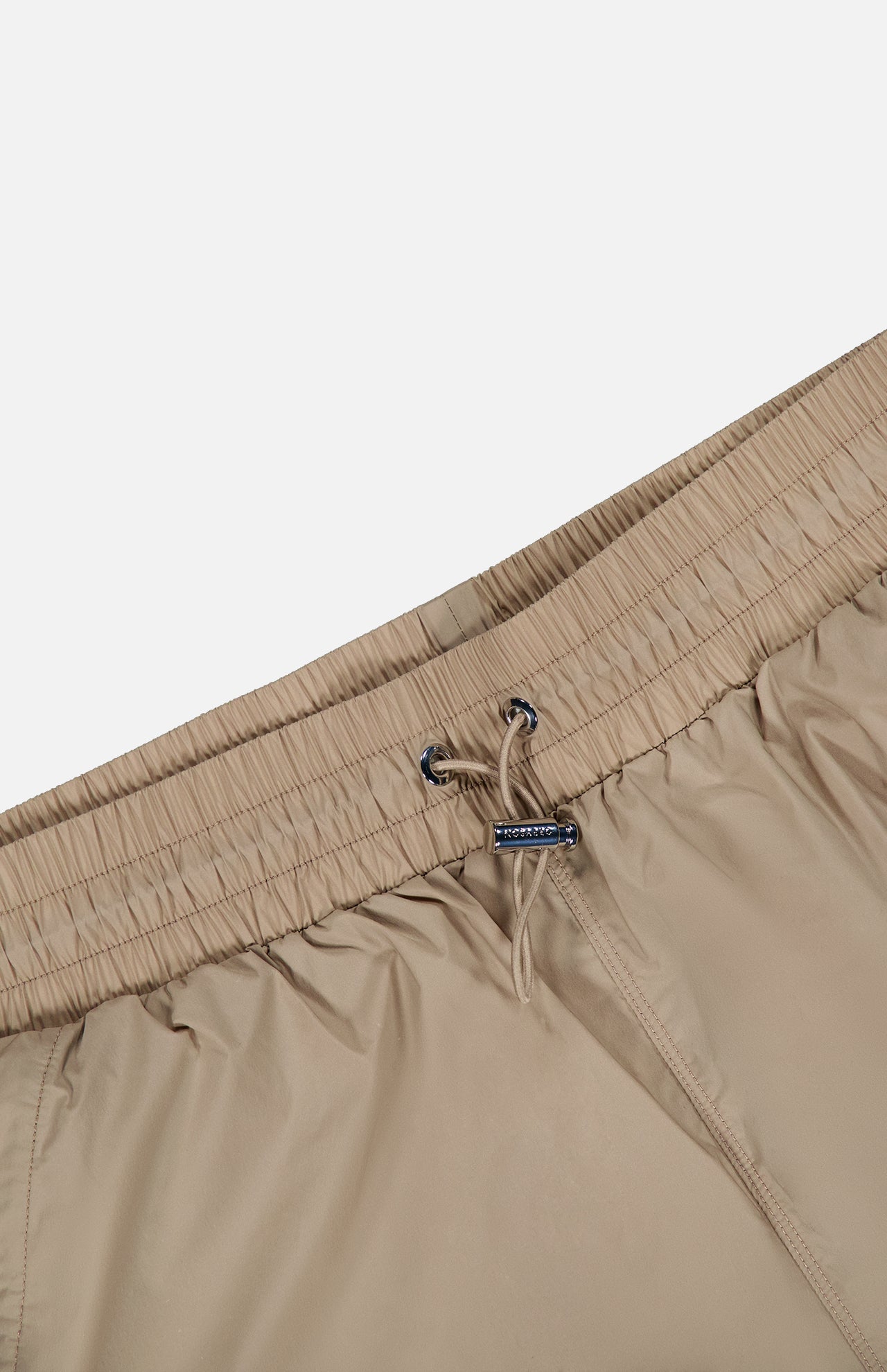 Beige Wide Nylon Pant with Drawcords featuring an elasticized waistband and a metal-tipped drawstring.