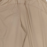 Close-up of the back of beige stretch nylon Wide Nylon Pant with Drawcords featuring an elasticized waistband and seaming detail.