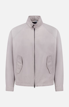 The HERNO Dean Cotton Bomber Zip Jacket is a men's light grey, minimalist spring outerwear featuring long sleeves, high collar, front zipper closure, and two angled pockets in a clean, unbranded bomber jacket style.