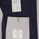 Close-up of the Dean Cotton Bomber Zip Jacket by HERNO in light grey, highlighting two inner labels—one reading Herno Rain Collection and another labeled Officina Tessile—a refined pick for men’s spring outerwear.