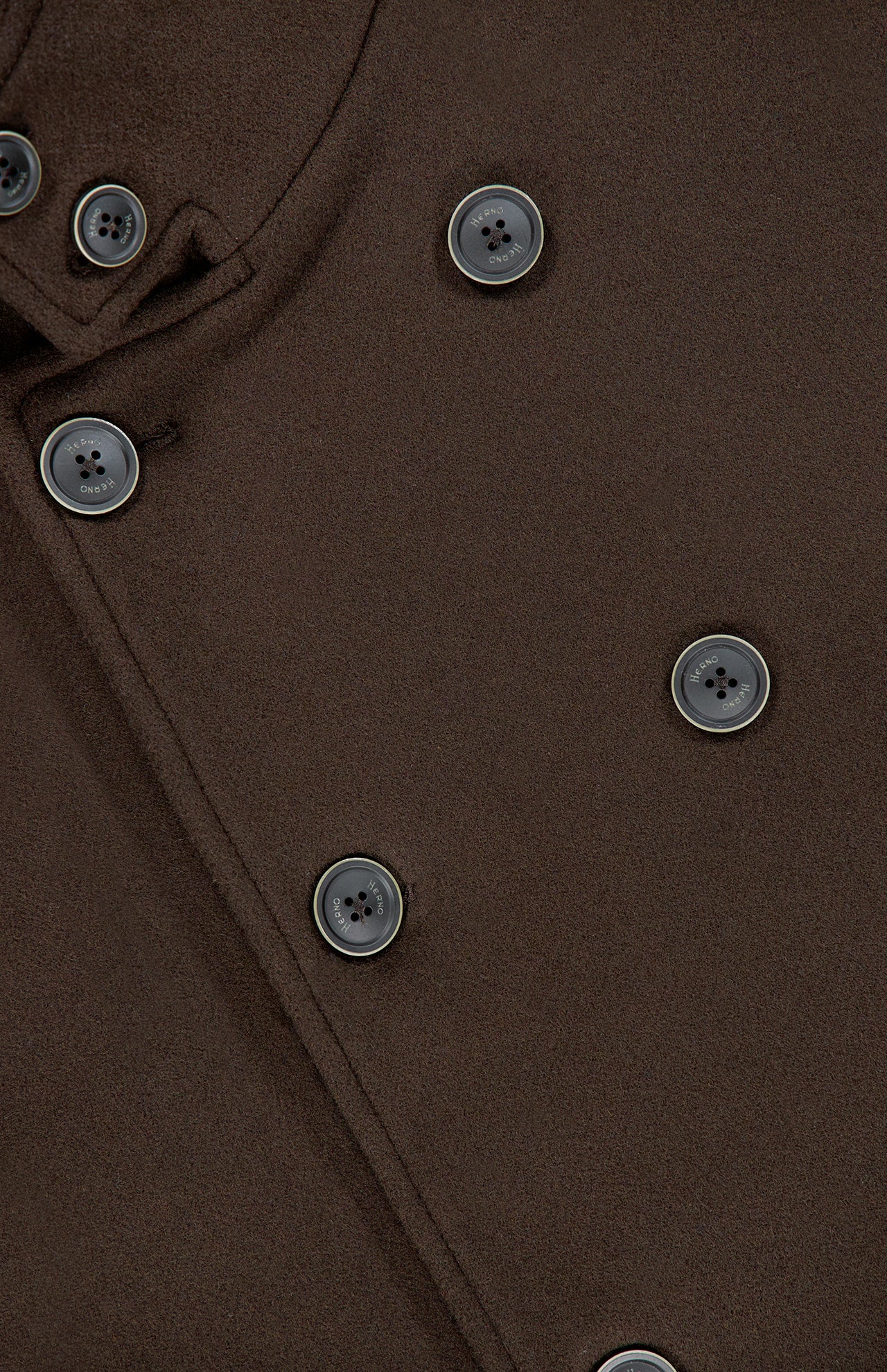 Close-up of the HERNO Wool Blend Double Breasted Peacoat in brown, showcasing its black buttons and smooth wool-blend texture. This timeless men’s outerwear piece is accentuated by detailed images of its flap and button details.