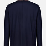 The Wool Silk Blend Jacket by HERNO is displayed from the back, showcasing long sleeves, a straight hem, and a standing collar. Crafted from smooth fabric with a simple, unembellished design, it presents a refined approach to men’s designer outerwear.