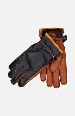 The HESTRA Wakayama Ski Gloves feature leather construction with brown palms and fingers, dark brown backs, yellow-lined cuffs, a snap closure on one glove, and include a removable wool liner for warmth and versatility.