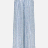 The HEVRON Alina Wide Leg Linen Pant in light blue features a high-rise waist, wide legs, vertical white stripes, pleats at the waist, belt loops, and a front closure. Shown on a plain white background.