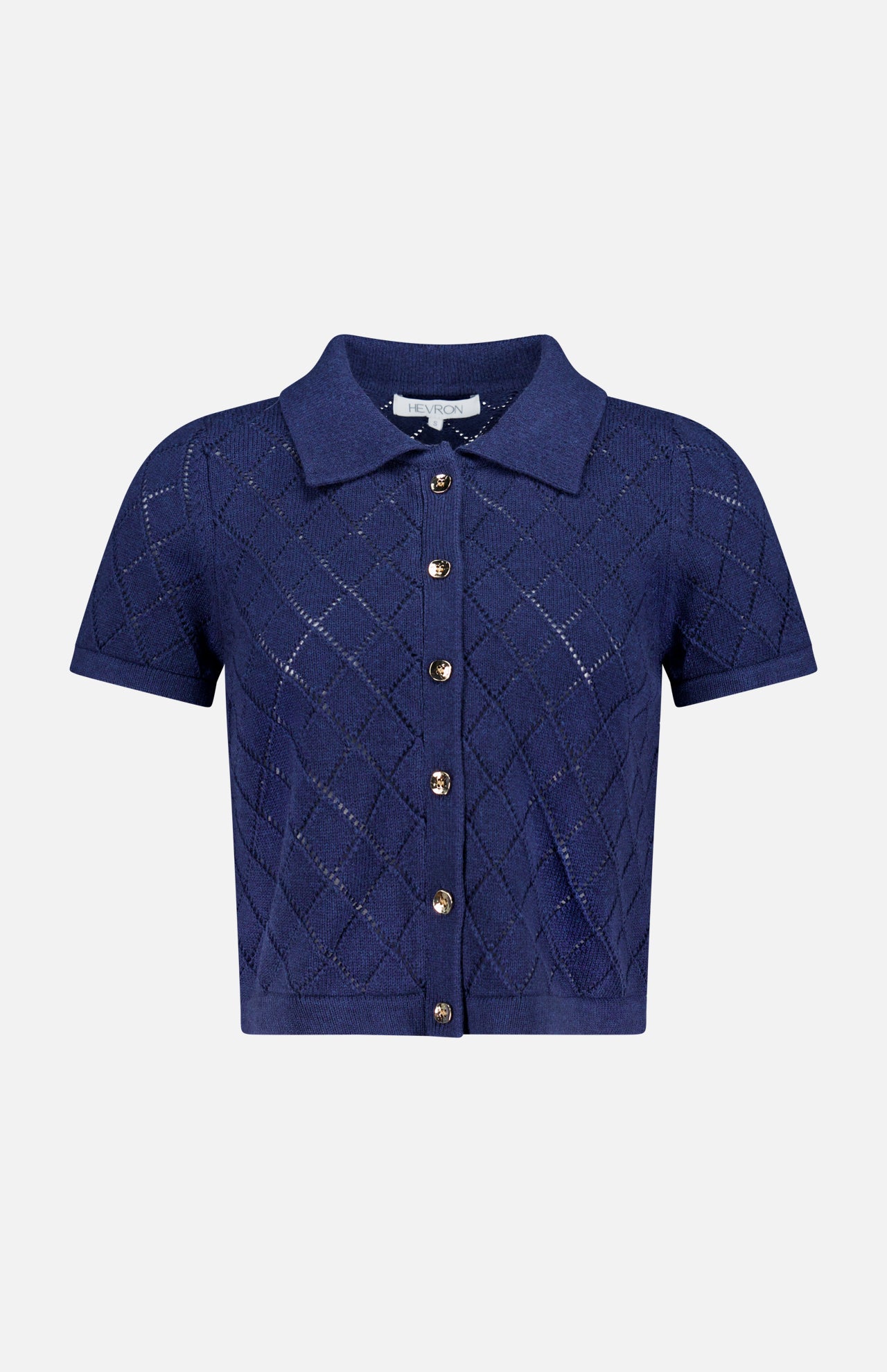 The Arlet Diamond Pointelle Top by HEVRON features short sleeves, a classic collar, gold front buttons, and a navy diamond pointelle knit, shown against a plain white background.