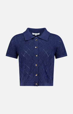 The Arlet Diamond Pointelle Top by HEVRON features short sleeves, a classic collar, gold front buttons, and a navy diamond pointelle knit, shown against a plain white background.