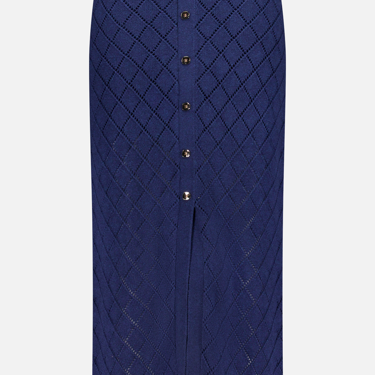 The Mia Knit Midi Skirt by HEVRON is a navy midi skirt with a diamond pointelle pattern, front buttons, and a small front slit at the hem.