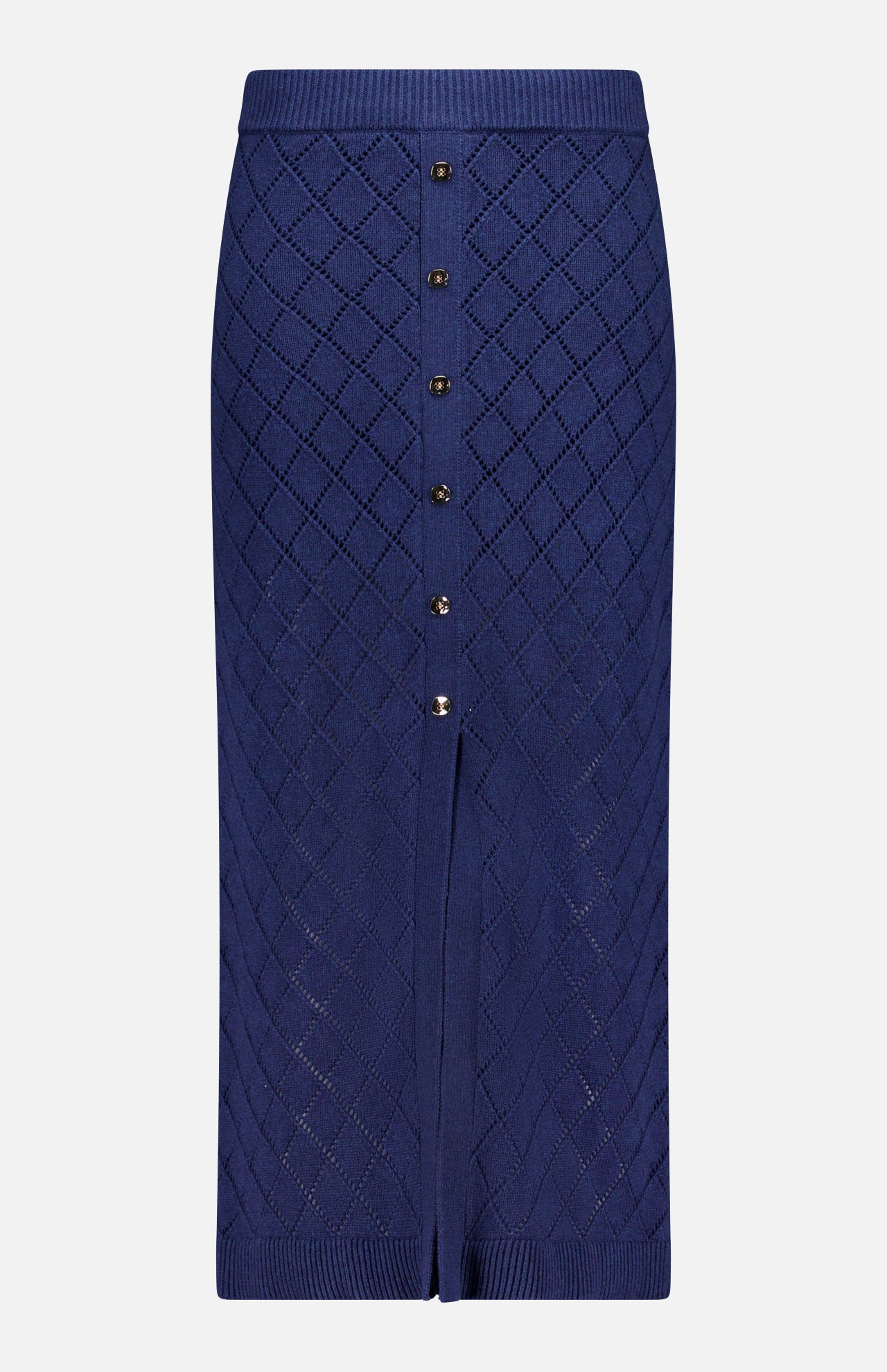 The Mia Knit Midi Skirt by HEVRON is a navy midi skirt with a diamond pointelle pattern, front buttons, and a small front slit at the hem.