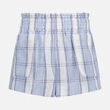 The HEVRON Mira Plaid Linen Short features light blue and white vertical and horizontal stripes, an elastic waistband, and is shown against a plain white background.