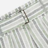 Close-up of the HEVRON Zinna Striped Linen Short's waistband, showcasing its metal rectangular buckle and vertical white, grey, and light green stripes—ideal texture and design for summer.