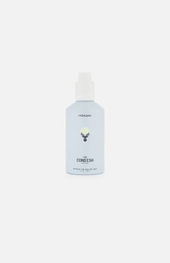 A light blue bottle labeled HIGHLAND STYLE CO. The Condish Hair Conditioner with a white cap, featuring a simple black line drawing of a moose head on the front, set against a plain white background. This silicone-free, lightweight conditioner is designed to hydrate hair without weighing it down.