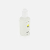 A white pump bottle of HIGHLAND STYLE CO. The Wash Hair Care features minimalist labeling with a small yellow illustration and the word WASH on the front, set against a plain white background.