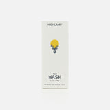 A white rectangular box labeled HIGHLAND STYLE CO. with a yellow sun and antler graphic features The Wash Hair Care, 10 fl oz / 300 mL—a pH balanced cleanser optimized for healthy hair growth and scalp care on the front.