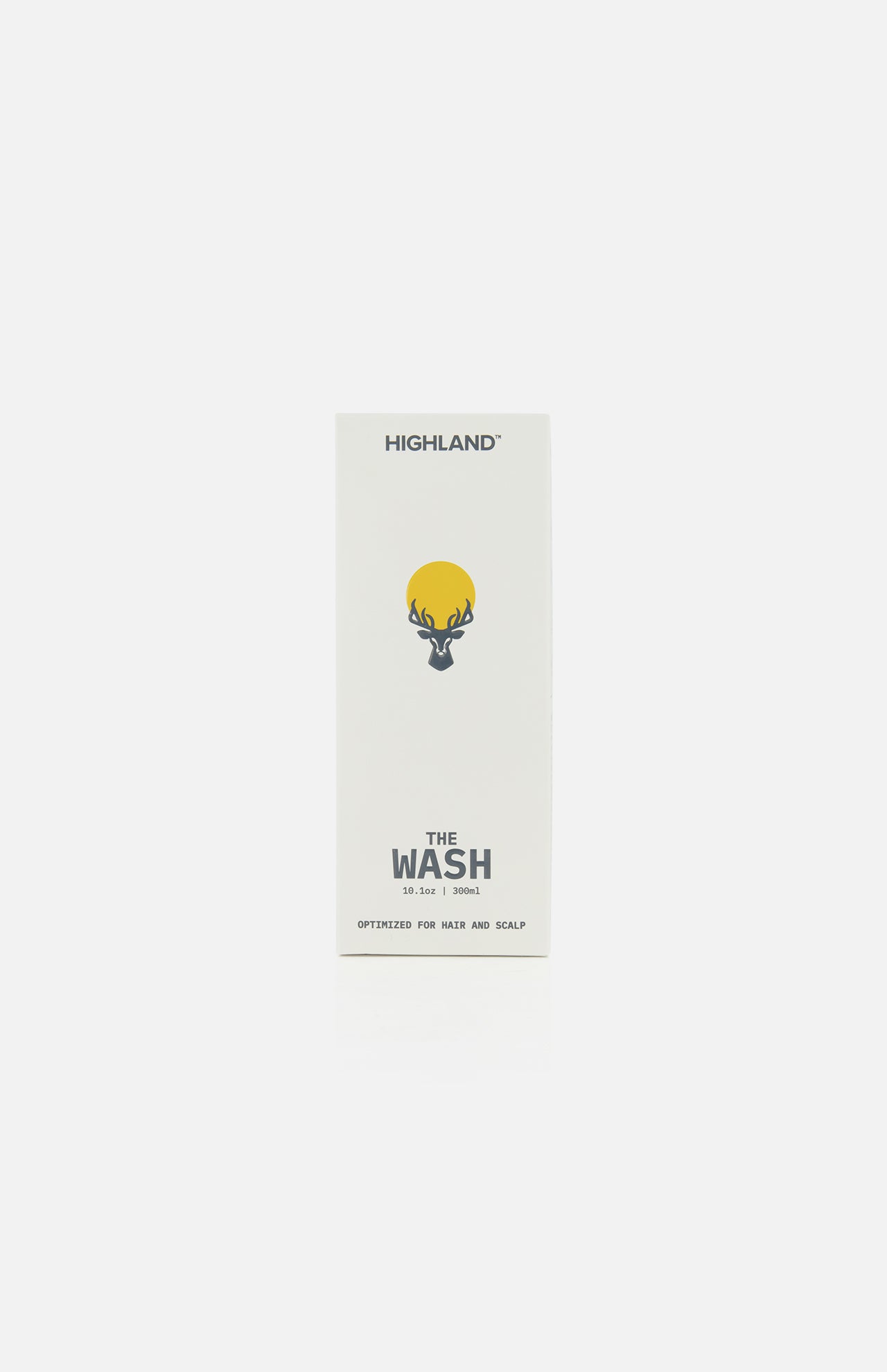 A white rectangular box labeled HIGHLAND STYLE CO. with a yellow sun and antler graphic features The Wash Hair Care, 10 fl oz / 300 mL—a pH balanced cleanser optimized for healthy hair growth and scalp care on the front.