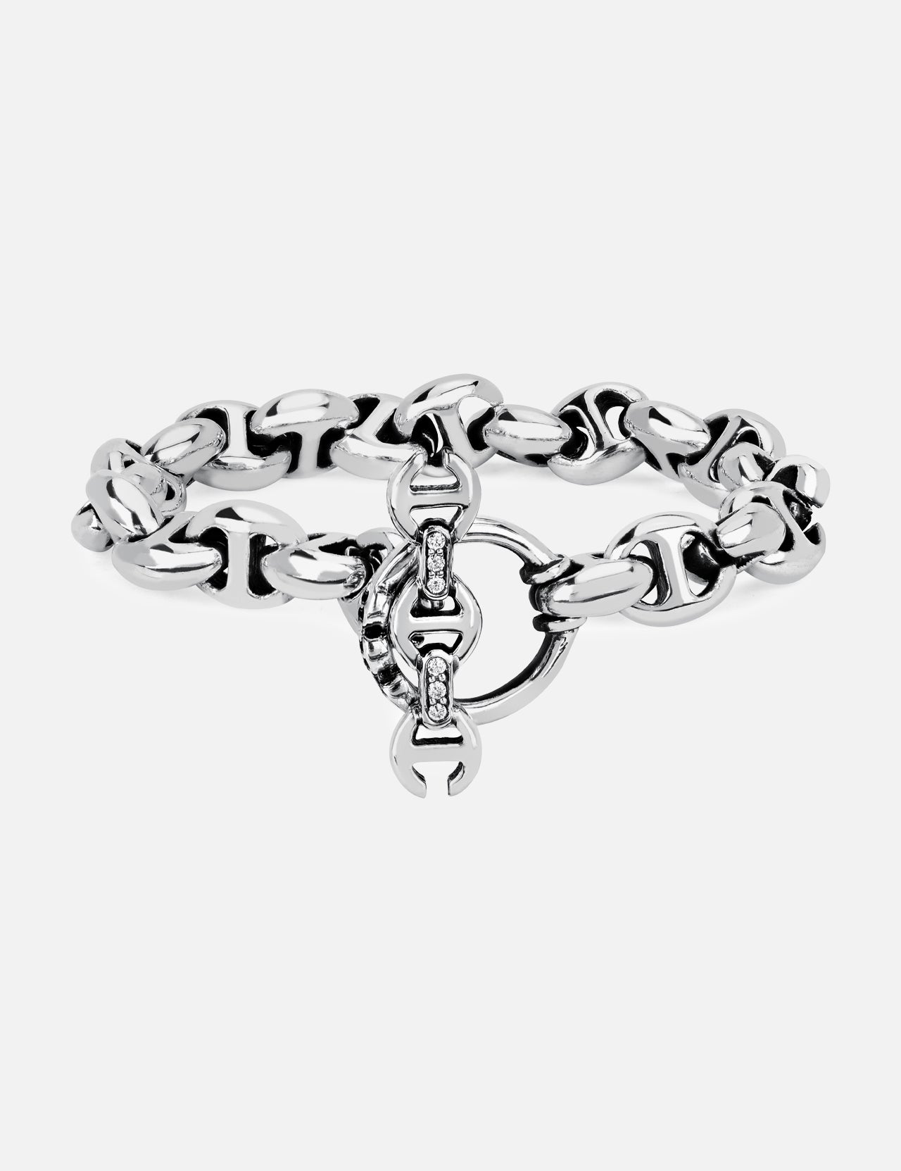 The HOORSENBUHS 10MM Open-Link Bracelet is a chunky sterling silver piece featuring an interlocking circular clasp and small embedded gemstones at the center. Displayed on a plain white background, this unisex bracelet seamlessly blends modern elegance with timeless appeal.