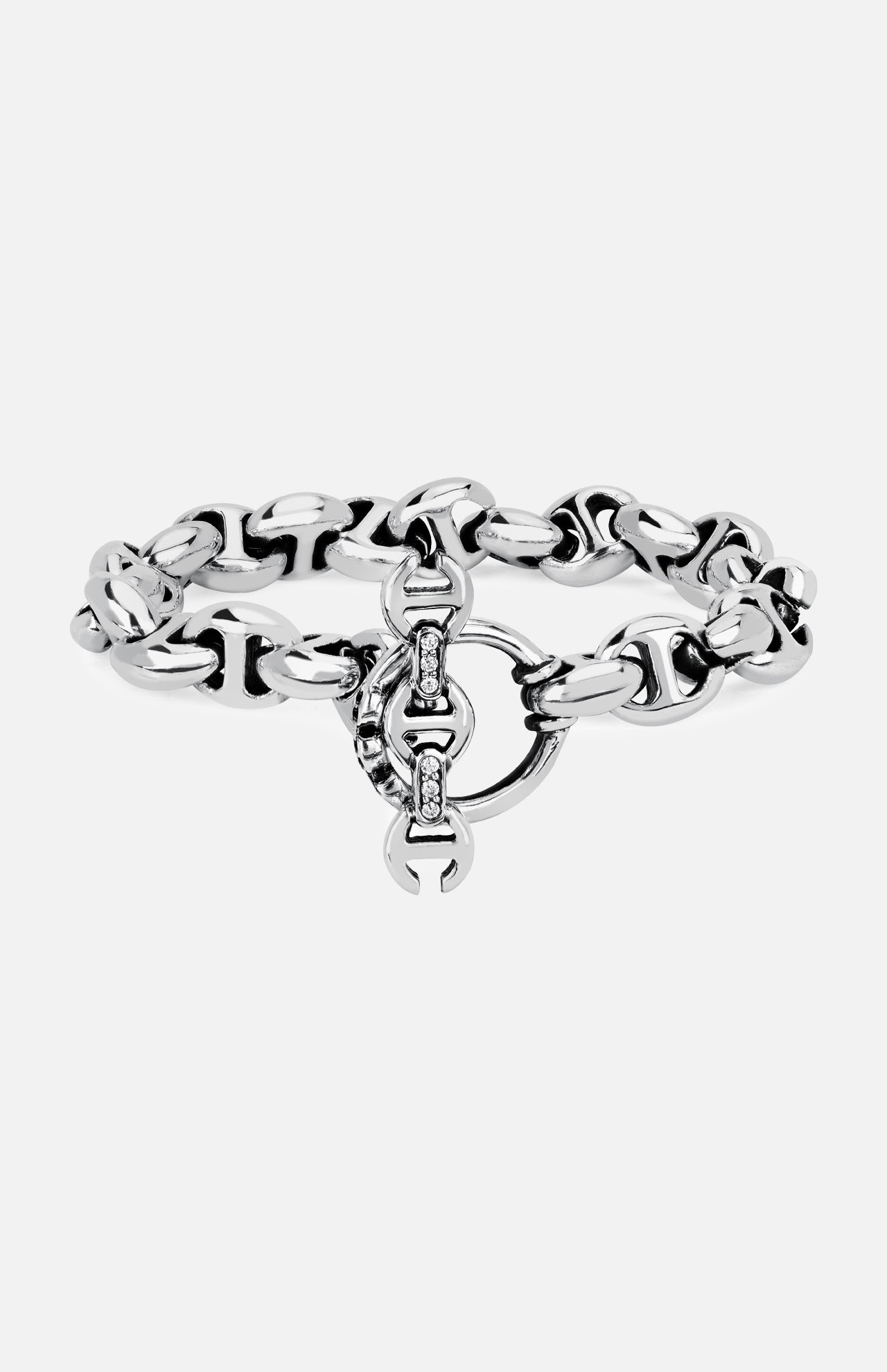 The HOORSENBUHS 10MM Open-Link Bracelet is a chunky sterling silver piece featuring an interlocking circular clasp and small embedded gemstones at the center. Displayed on a plain white background, this unisex bracelet seamlessly blends modern elegance with timeless appeal.