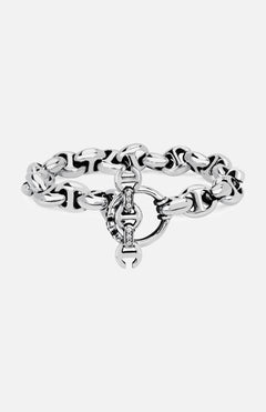 The HOORSENBUHS 10MM Open-Link Bracelet is a chunky sterling silver piece featuring an interlocking circular clasp and small embedded gemstones at the center. Displayed on a plain white background, this unisex bracelet seamlessly blends modern elegance with timeless appeal.
