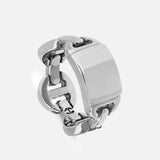The Brute Classic Tri-Link Monogram Ring by HOORSENBUHS is a bold sterling silver piece, characterized by its chunky tri-link design and a wide, flat rectangular front surface—presented against a plain light background, making it an eye-catching unisex accessory.