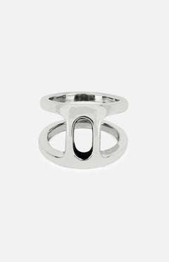 The Dame Phantom II Ring by HOORSENBUHS features two parallel sterling silver bands connected by a vertical bar and an oval cutout at the center, showcasing a subtle tri-link motif. Displayed on a plain white background, this distinctive piece is an ideal choice for unisex jewelry lovers.