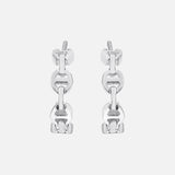 The HOORSENBUHS Micro Crescent Earrings are unisex silver hoops featuring a tri-link chain motif, shown against a plain white background.