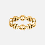 The HOORSENBUHS Micro Dame III Ring features a yellow gold band with an interlocking chain-link and tri-link motif, creating a modern unisex piece. Shown on a plain white background.