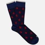Ncora All Over Short Socks by IN THE BOX, featuring red anchor patterns on navy with dark blue toes, heels, and cuffs plus gray trim, displayed on a plain white background.
