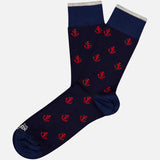 The Ncora All Over Short Socks by IN THE BOX feature a navy base with red anchors and light gray cuffs—perfect nautical socks to enhance any wardrobe.