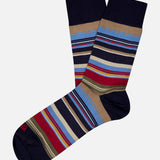 The Stripes Short Socks by IN THE BOX are made in Milan from a cotton blend, featuring navy blue, light blue, red, beige, and white stripes on light gray with solid navy blue toe, heel, and cuff.