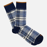 IN THE BOX Tartan Short Socks: blue and white plaid cotton-blend with dark blue toes, heels, and cuffs, finished with a thin brown stripe at the top. Socks are displayed flat on a light background.