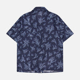 The ISAIA Corallina Print Camp Shirt features a navy blue short-sleeve design with a light blue coral reef pattern, shown flat with the back facing up on a plain white background.