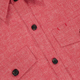 Close-up of the ISAIA Double Play Woolinen Delave Overshirt in red, featuring textured fabric, black buttons, two chest flap pockets, and a pointed collar.