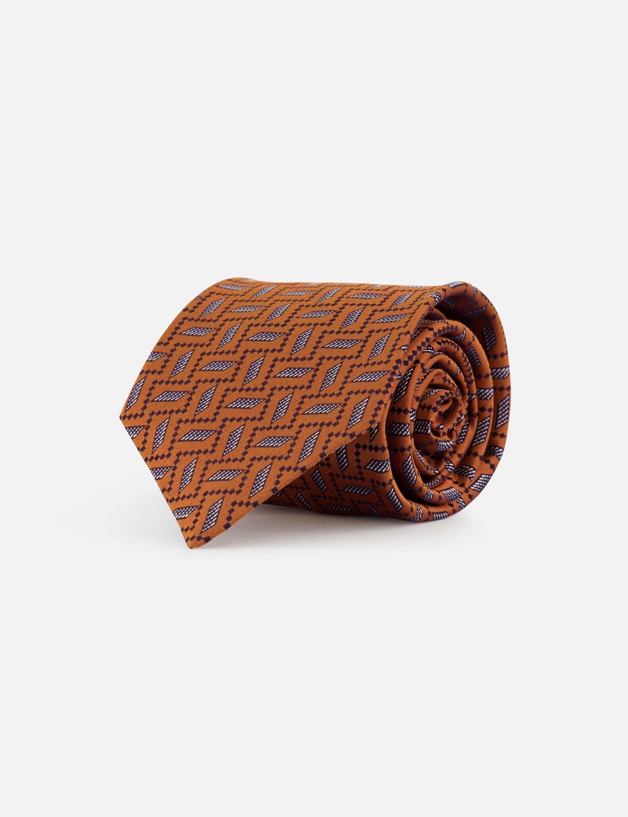 The Fantasia Cravatte Graphic Visuals Tie by ISAIA is a burnt orange silk necktie with a geometric diamond print in navy and light blue, neatly rolled and displayed on a white background.