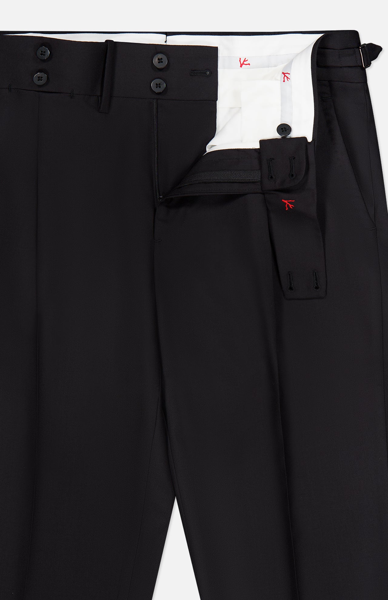 Presenting the 150′s Timeless Casalnuovo Trouser Pant by ISAIA: expertly crafted in Italy, these black wool dress pants feature a fly open to reveal a white inner lining with striking red stitching accents. Two adjustable black waistband tabs are visible next to the zipper area, highlighting ISAIA’s refined craftsmanship and contemporary style.