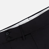Close-up of the waistband of ISAIA’s 150′s Timeless Casalnuovo Trouser Pant in black, featuring two black buttons, belt loops, and a white inner lining at the top, highlighting the refined craftsmanship characteristic of Italian-made wool trousers.