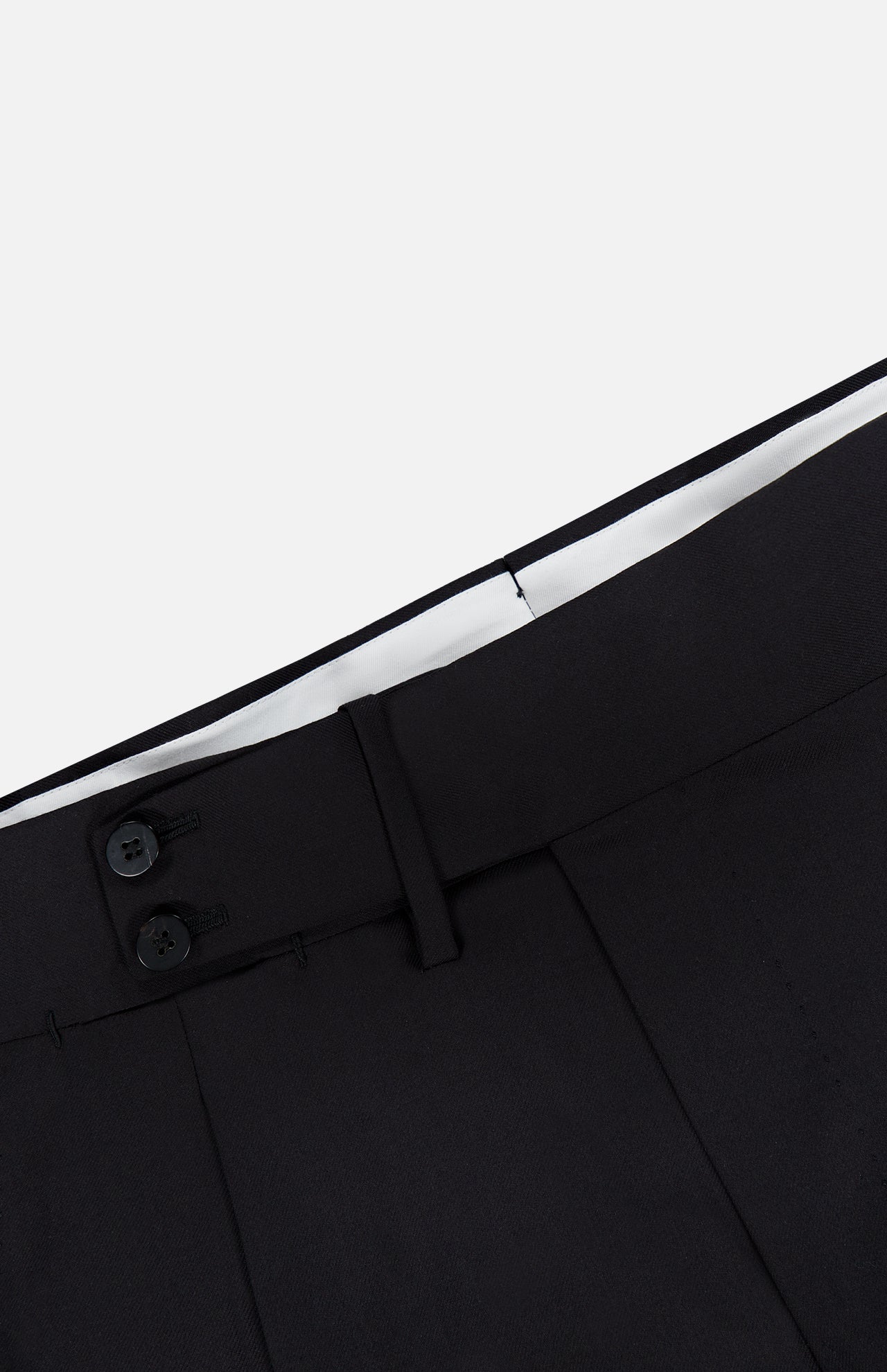 Close-up of the waistband of ISAIA’s 150′s Timeless Casalnuovo Trouser Pant in black, featuring two black buttons, belt loops, and a white inner lining at the top, highlighting the refined craftsmanship characteristic of Italian-made wool trousers.