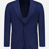 Showcased against a plain white background, the Australian Merinos Double Face Sportcoat by ISAIA is a navy blue men’s blazer crafted in Italy. This elegant wool-blend jacket features notch lapels, two front patch pockets, two-button closure, and is highlighted by a subtle red accent on the left lapel.