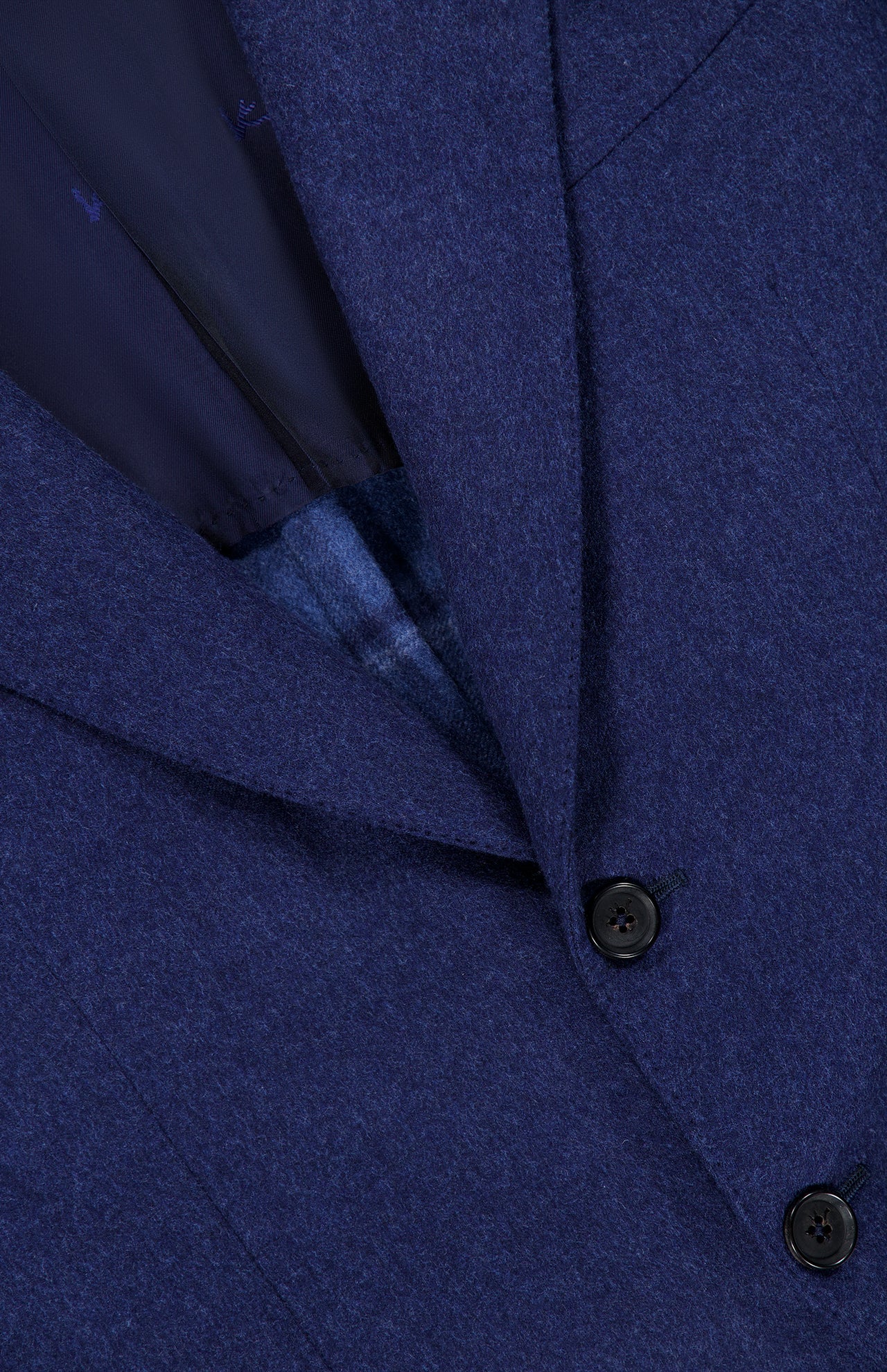 Close-up of the ISAIA Australian Merinos Double Face Sportcoat, made in Italy, featuring two black buttons, the lapel, and part of the jacket’s dark inner lining.