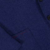 Close-up of the ISAIA Australian Merinos Double Face Sportcoat, made in Italy, featuring two black buttons, a classic lapel, and a front pocket with subtle red stitching detail on the wool-blend jacket.