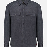 The ISAIA Cashmere Denim Effect Overshirt—a long-sleeve, button-up dark gray shirt featuring a collar and two chest pockets with buttoned flaps, crafted in luxurious cashmere for elevated men’s layering—is displayed on a plain white background.