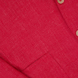 Close-up of the ISAIA Cashsilk & Linen Sportcoat, made in Italy, showing its textured red fabric, pocket, lapel, and two beige buttons.